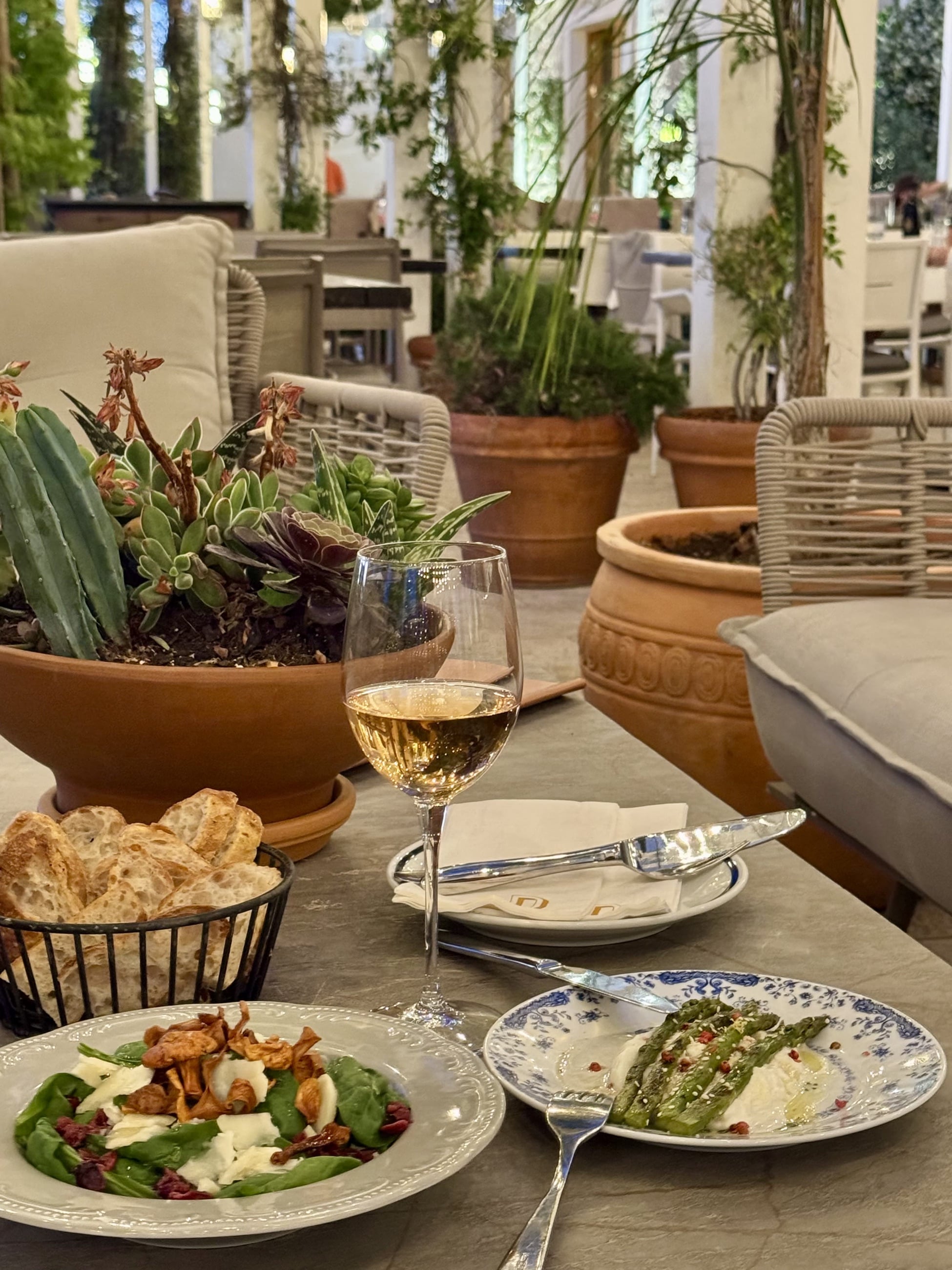 Bronzin sharing table and wine image from the supplied proposal.
