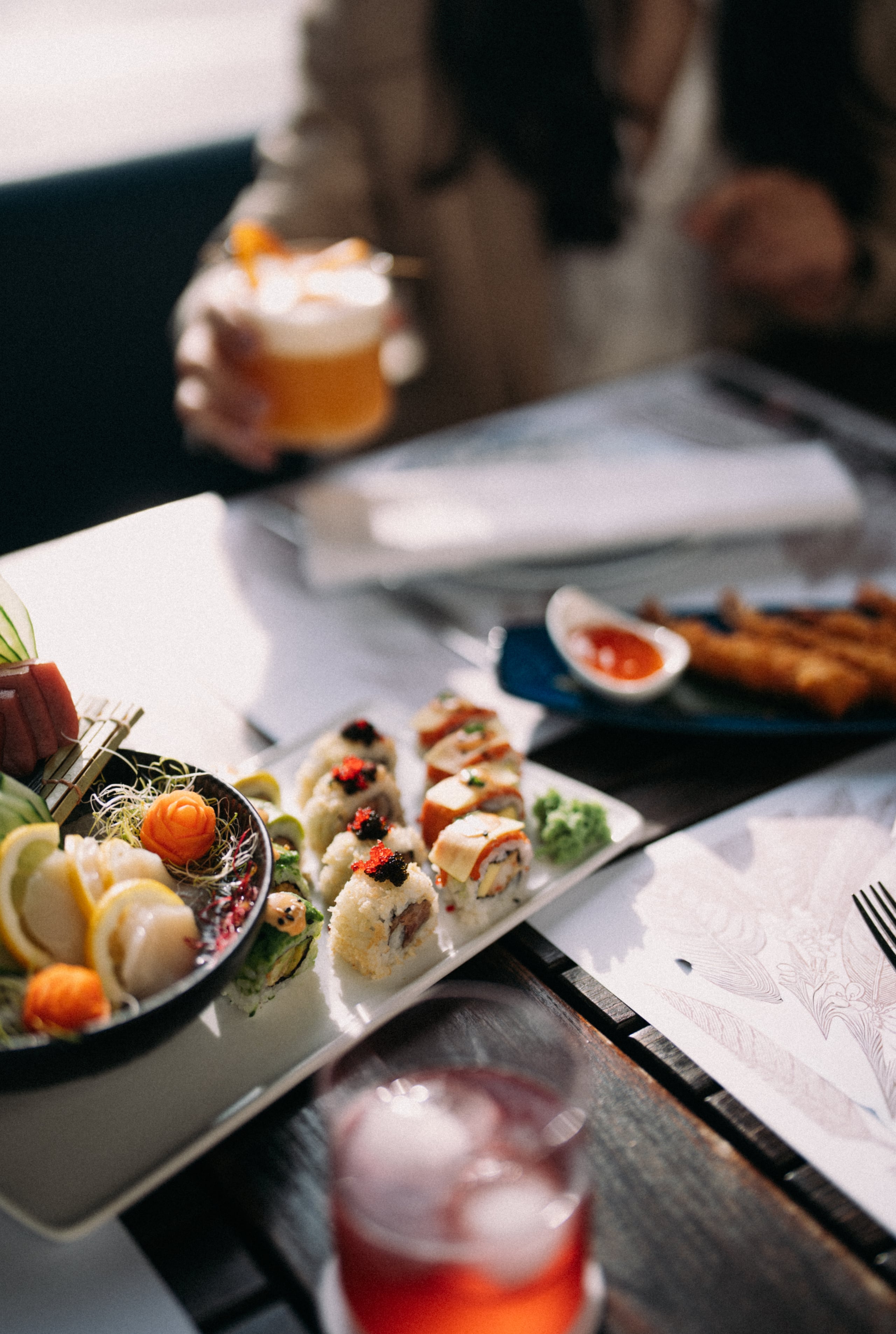 Shared sushi and mezze plates at Buta.