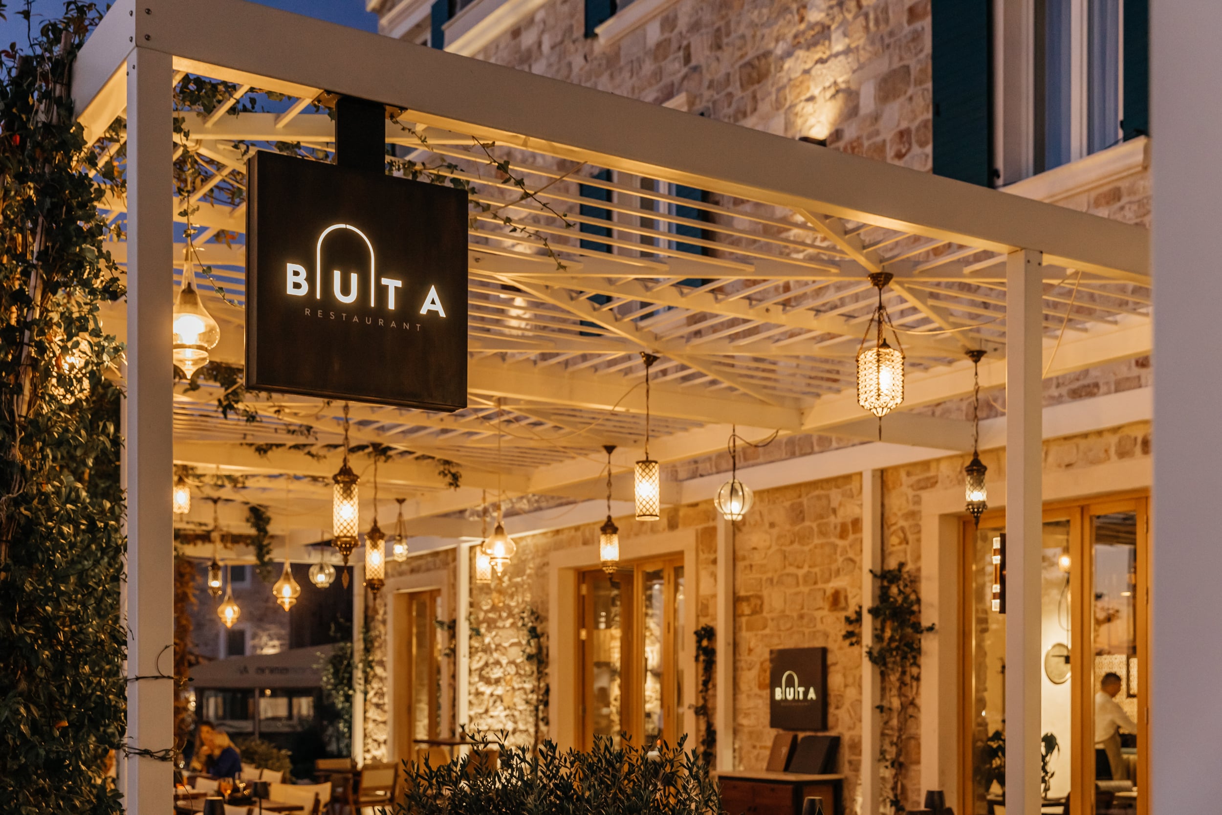 Buta restaurant exterior at evening.