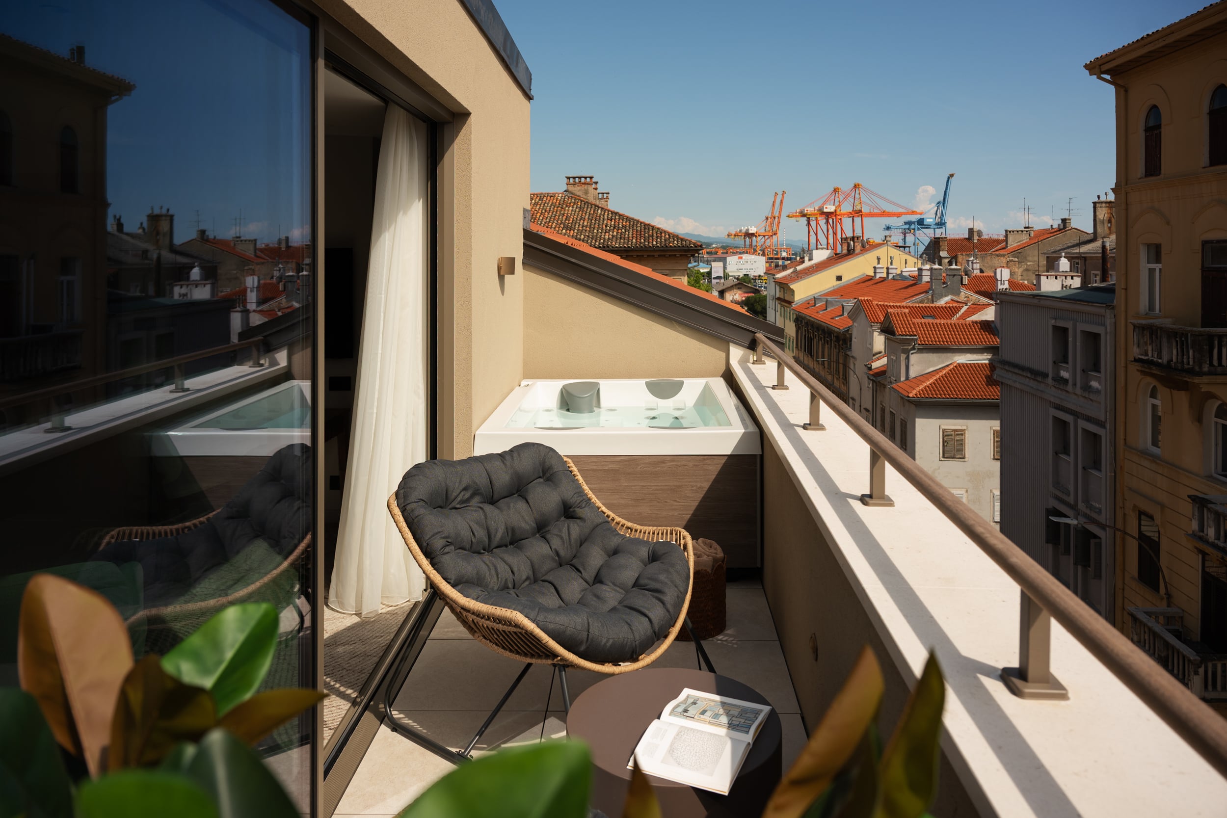 Private jacuzzi terrace and city view at Armerun Rijeka room 503.
