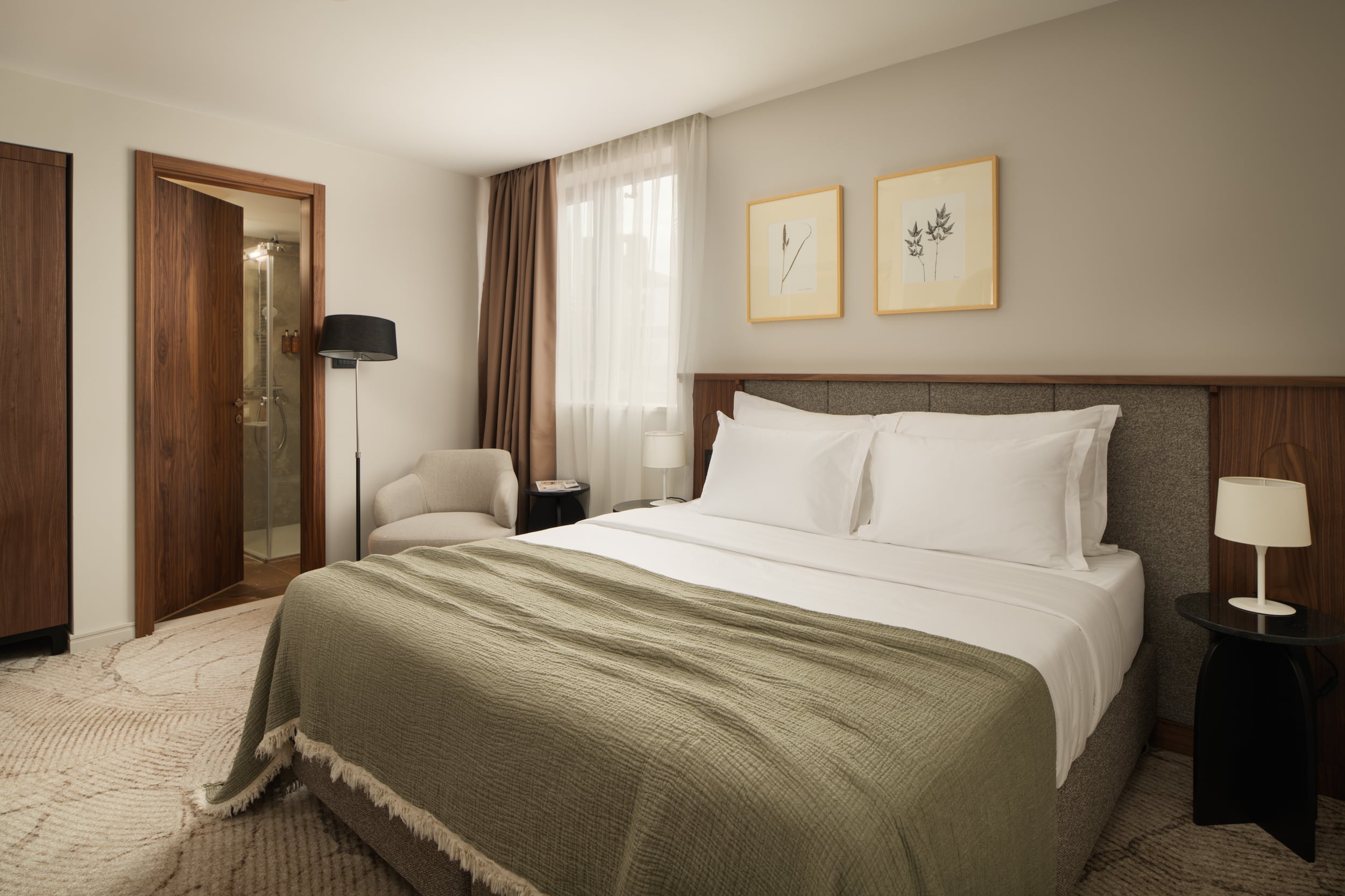 Armerun Rijeka room 403 with a double bed and city-facing window.