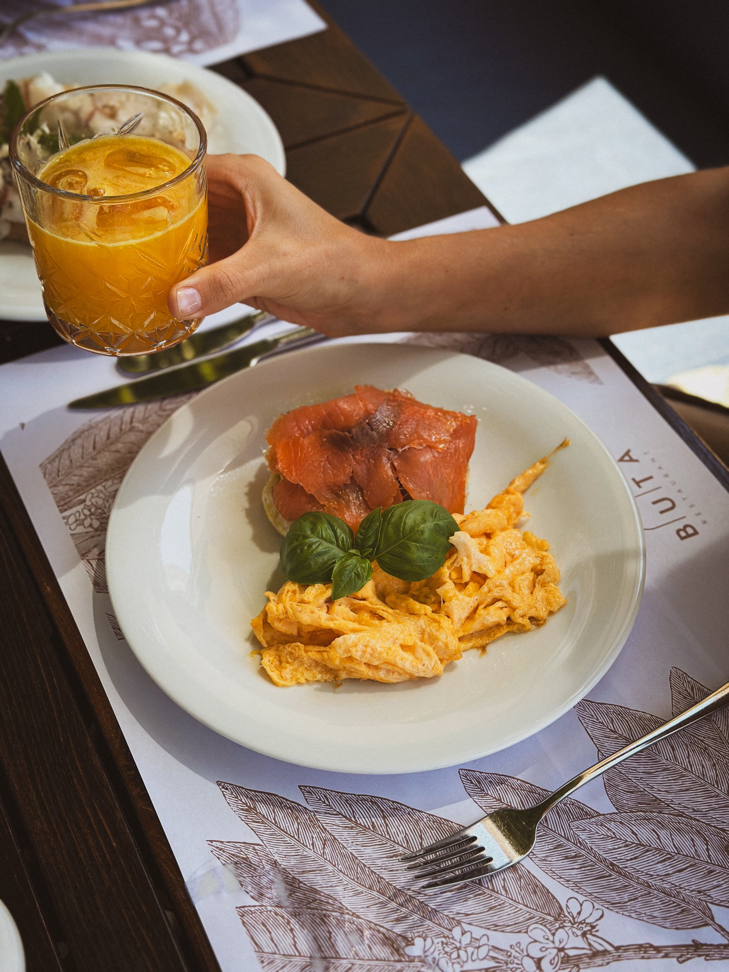 Scrambled eggs with fresh juice at breakfast.