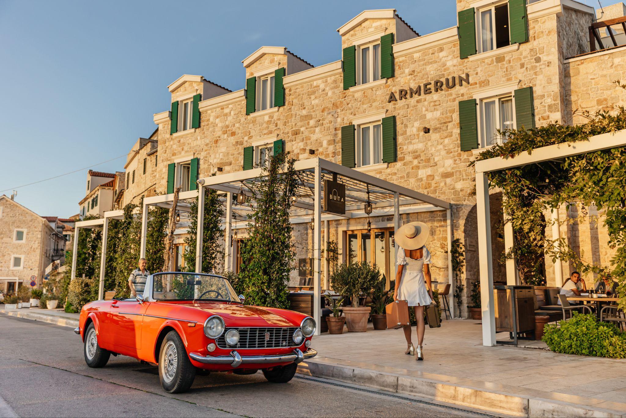 The stone facade of Armerun Heritage Hotel and Residences Šibenik at golden hour.